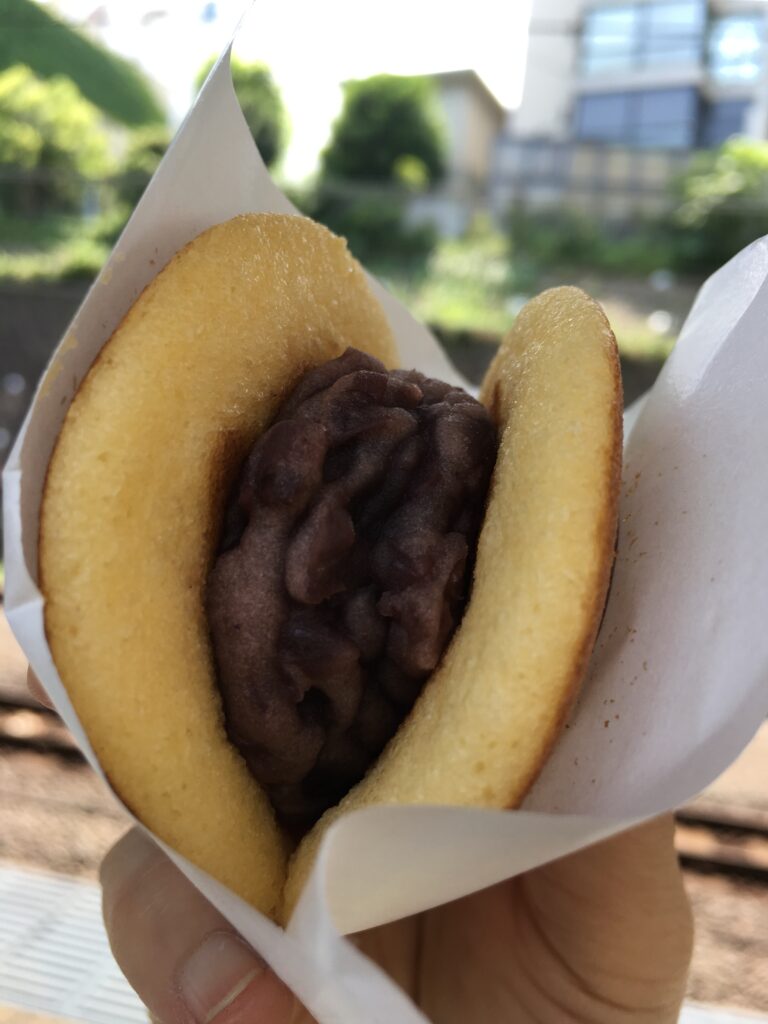 Eating mini dorayaki in the business district